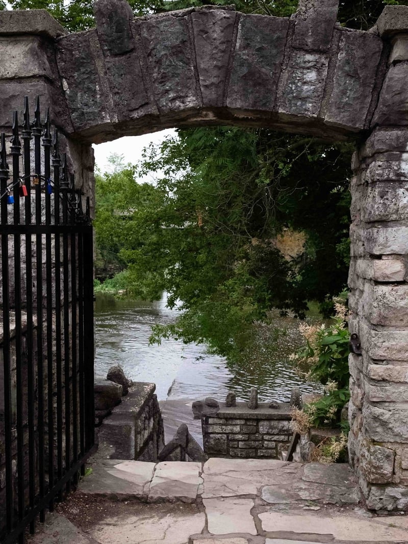 Iron gate archway opening to the Grand River, Fergus