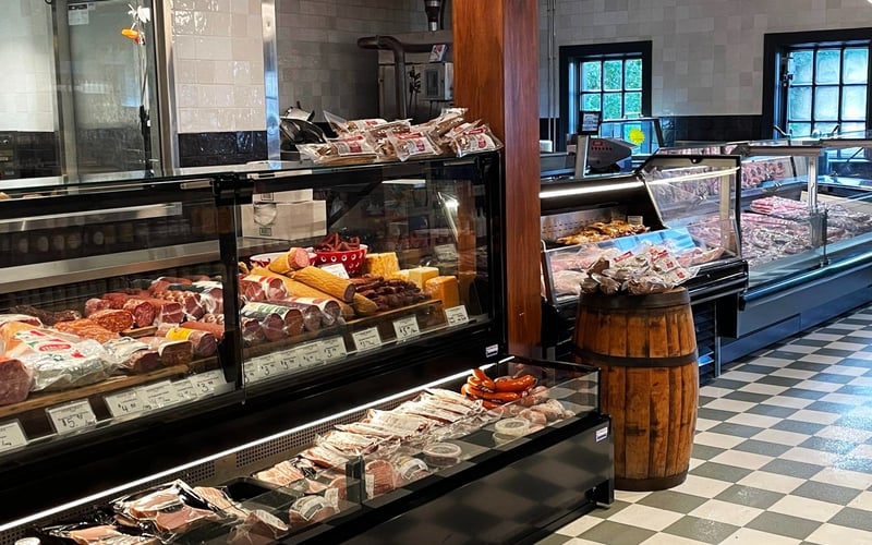 Butcher and deli counter with charcuterie and cheeses