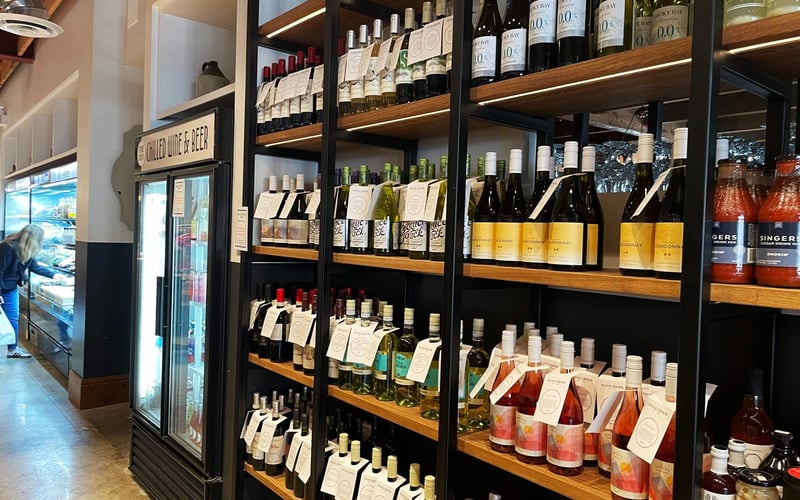 Stone Crock wine and beer shop with floor-to-ceiling shelves