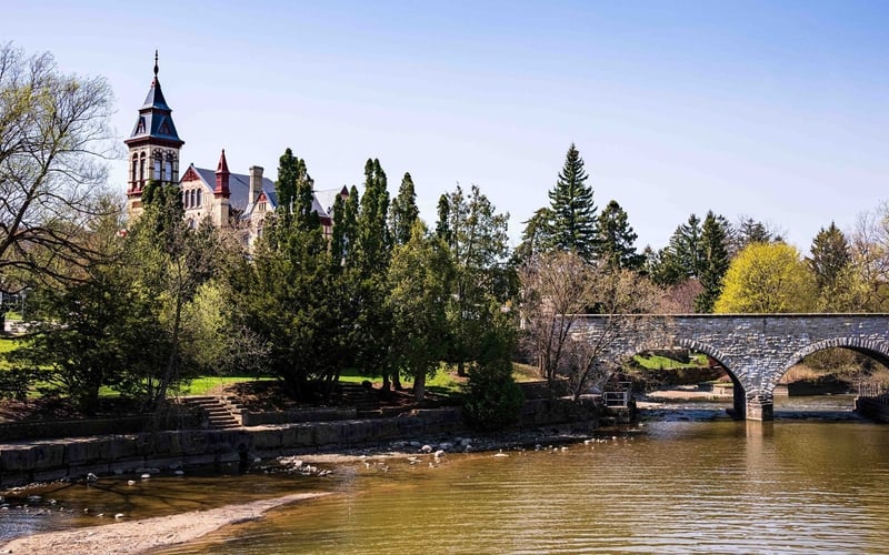 Stone bridge and Victorian building along the Avon River