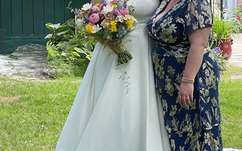 Mom and bride candid on the lawn