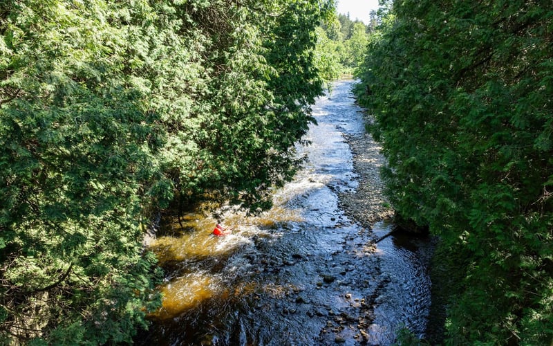 Aerial of red kayaker in gorge