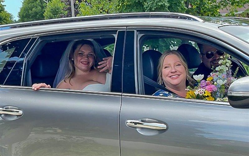 Going to the chapel — bride and mom in the car